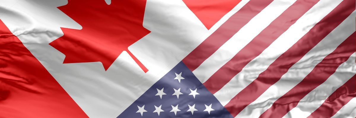 Photo of the canadian flag and the american flag